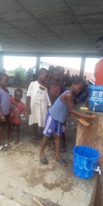 The children have been taught a Sierra Leone song about the importance of cleanliness to sing while they wash their hands for 20 seconds.