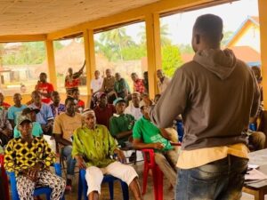 The local cocoa expert giving a talk to the farmers